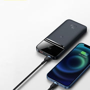 Magnetic Wireless Power Bank charging an iPhone, showcasing its sleek design and multi-U port output.