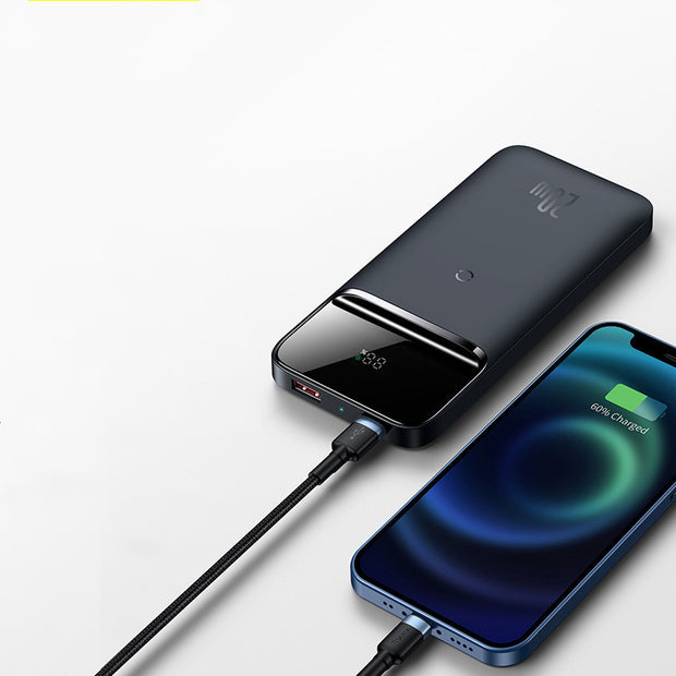 Magnetic Wireless Power Bank charging an iPhone, showcasing its sleek design and multi-U port output.