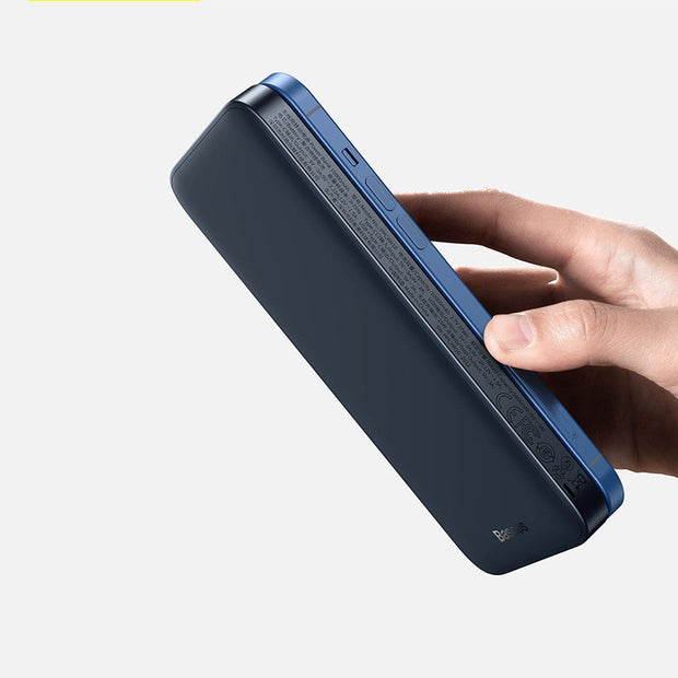 Magnetic Wireless Power Bank held in hand, showcasing its sleek design and multiple ports.